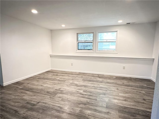 609 N Broadway St, Knob Noster, MO 65336 - empty room with dark wood-style flooring, baseboards, and recessed lighting