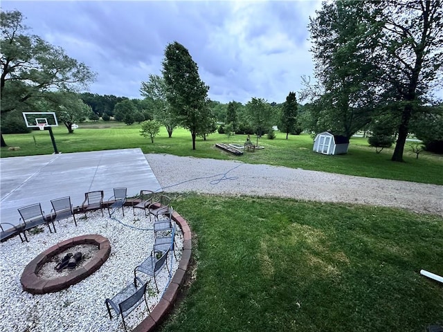 14409 Tillman Rd, Smithville, MO 64089 - view of grassy yard with an outdoor fire pit