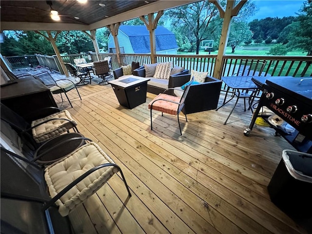 14409 Tillman Rd, Smithville, MO 64089 - wooden terrace with outdoor dining space, an outdoor living space with a fire pit, and a ceiling fan