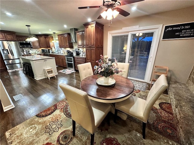 14409 Tillman Rd, Smithville, MO 64089 - dining area featuring a ceiling fan, dark wood-type flooring, and recessed lighting