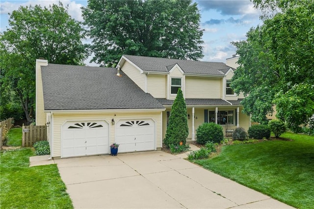 113 Willow Dr, Lansing, KS 66043 - traditional-style house featuring a garage, a chimney, concrete driveway, and a porch