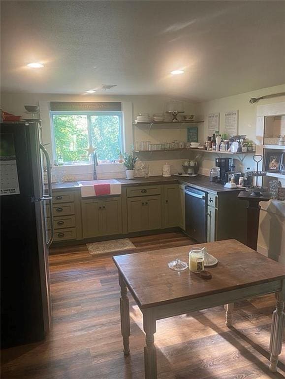 1596 Haskell Rd, Williamsburg, KS 66095 - kitchen featuring appliances with stainless steel finishes, a sink, dark wood-style floors, and dark countertops