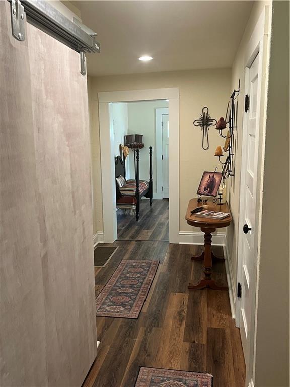 1596 Haskell Rd, Williamsburg, KS 66095 - corridor with wood finished floors, recessed lighting, and baseboards