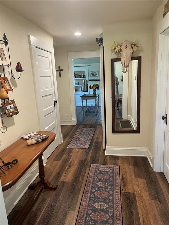 1596 Haskell Rd, Williamsburg, KS 66095 - corridor featuring wood finished floors, baseboards, and recessed lighting