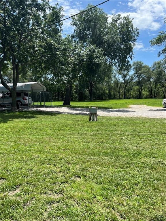 1596 Haskell Rd, Williamsburg, KS 66095 - view of green lawn featuring a carport