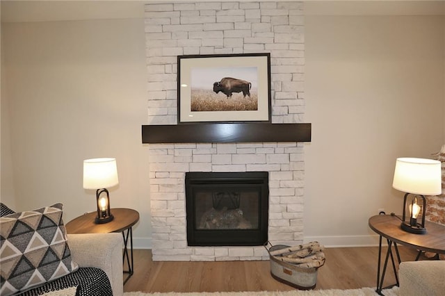 15595 N Sheridan Ct, Basehor, KS 66007 - detailed view of wood finished floors, a fireplace, and baseboards