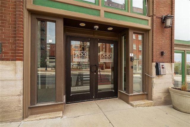 700 Broadway Blvd Unit 210, Kansas City, MO 64105 - doorway to property featuring french doors and brick siding