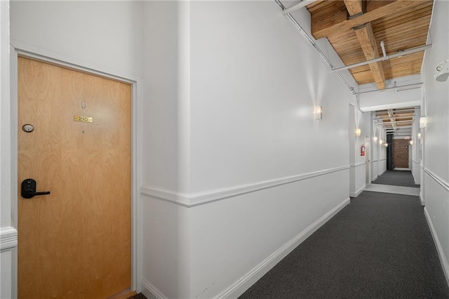 700 Broadway Blvd Unit 210, Kansas City, MO 64105 - hall featuring wood ceiling with exposed beams and baseboards