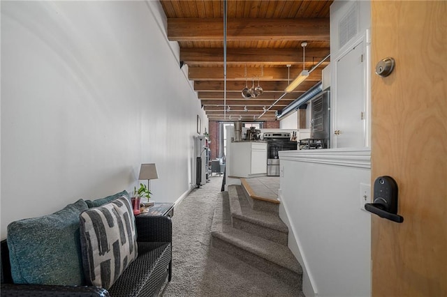 700 Broadway Blvd Unit 210, Kansas City, MO 64105 - staircase with wooden ceiling with exposed beams and carpet floors