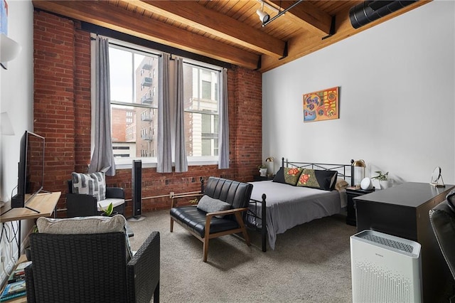700 Broadway Blvd Unit 210, Kansas City, MO 64105 - carpeted bedroom featuring wooden ceiling with exposed beams and brick wall