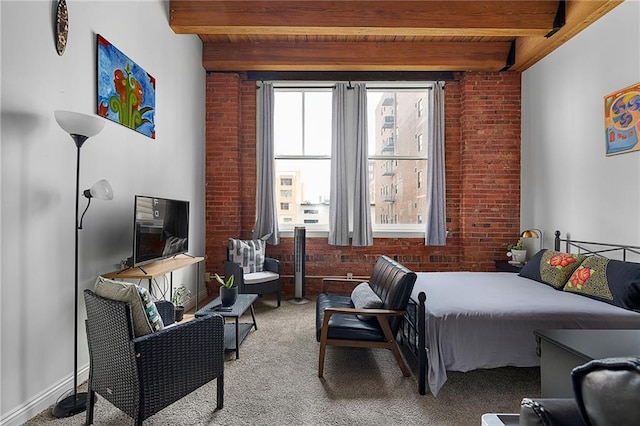 700 Broadway Blvd Unit 210, Kansas City, MO 64105 - carpeted bedroom featuring wooden ceiling with exposed beams and brick wall