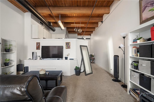 700 Broadway Blvd Unit 210, Kansas City, MO 64105 - carpeted living area featuring wood ceiling with exposed beams, a high ceiling, and baseboards