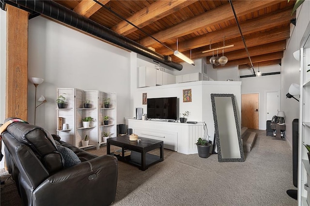700 Broadway Blvd Unit 210, Kansas City, MO 64105 - living room featuring wood ceiling with exposed beams, a towering ceiling, and carpet flooring