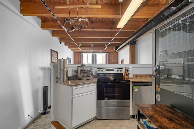 700 Broadway Blvd Unit 210, Kansas City, MO 64105 - kitchen with appliances with stainless steel finishes, wood ceiling with exposed beams, white cabinetry, and light stone countertops
