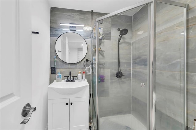 2831 E 8th St, Kansas City, MO 64124 - full bathroom with vanity, a stall shower, and tasteful backsplash
