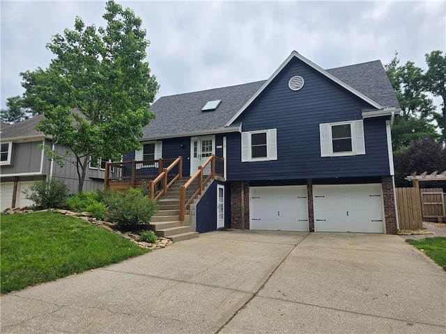 16011 W 149th Ter, Olathe, KS 66062 - view of front of home featuring an attached garage, roof with shingles, driveway, and brick siding