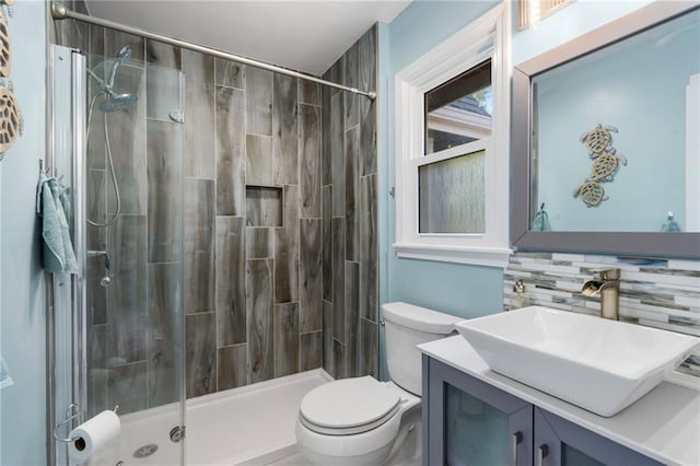 16011 W 149th Ter, Olathe, KS 66062 - full bathroom featuring vanity, a stall shower, and tasteful backsplash