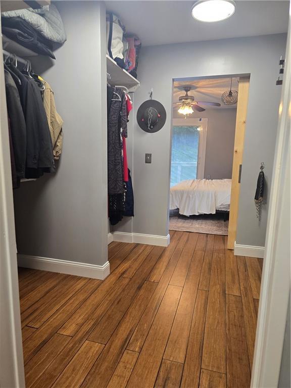 16011 W 149th Ter, Olathe, KS 66062 - walk in closet featuring hardwood / wood-style flooring and ceiling fan