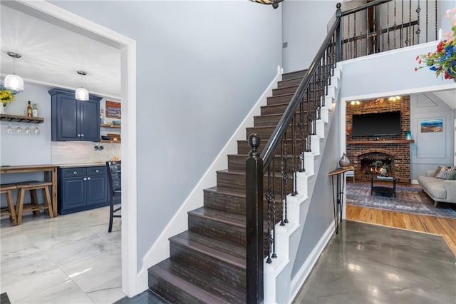 16011 W 149th Ter, Olathe, KS 66062 - stairs featuring baseboards and a brick fireplace