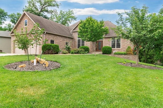 906 Cheatham Ct, Warrensburg, MO 64093 - view of front of property featuring brick siding, a front lawn, a garage, and a shingled roof