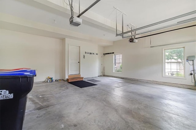 906 Cheatham Ct, Warrensburg, MO 64093 - garage featuring a garage door opener