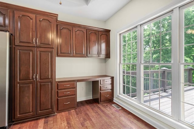 906 Cheatham Ct, Warrensburg, MO 64093 - unfurnished office with built in study area and wood finished floors