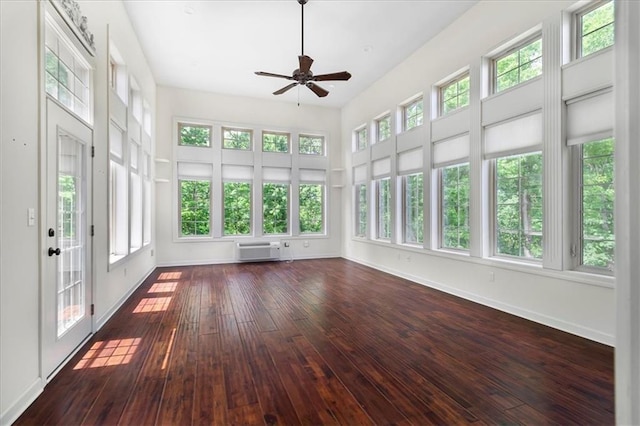 906 Cheatham Ct, Warrensburg, MO 64093 - unfurnished sunroom featuring a wall unit AC, hardwood / wood-style floors, and baseboards