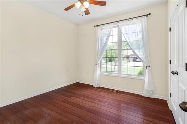 906 Cheatham Ct, Warrensburg, MO 64093 - unfurnished room featuring dark wood finished floors, ceiling fan, and baseboards