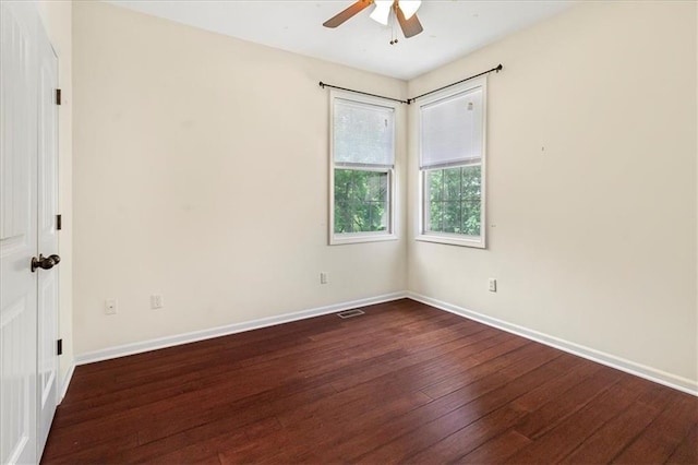 906 Cheatham Ct, Warrensburg, MO 64093 - empty room with dark wood-type flooring, ceiling fan, and baseboards