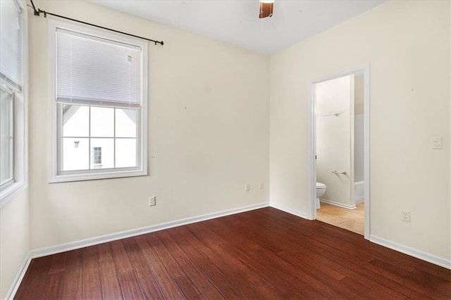 906 Cheatham Ct, Warrensburg, MO 64093 - empty room with hardwood / wood-style floors and baseboards