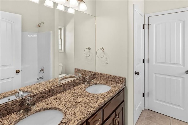 906 Cheatham Ct, Warrensburg, MO 64093 - bathroom featuring double vanity, bathing tub / shower combination, toilet, and tile patterned flooring