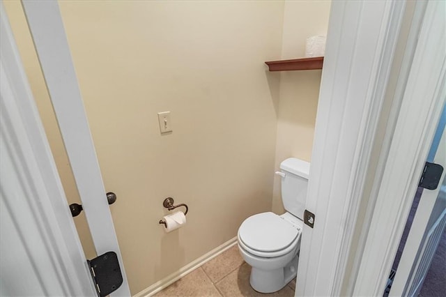 906 Cheatham Ct, Warrensburg, MO 64093 - bathroom featuring toilet, tile patterned floors, and baseboards