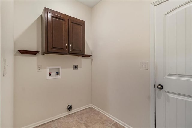 906 Cheatham Ct, Warrensburg, MO 64093 - laundry area featuring hookup for an electric dryer, hookup for a washing machine, baseboards, and cabinet space