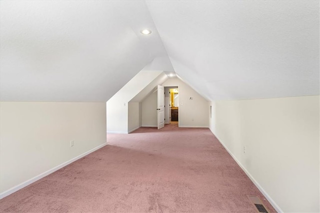 906 Cheatham Ct, Warrensburg, MO 64093 - bonus room featuring vaulted ceiling, light colored carpet, baseboards, and recessed lighting