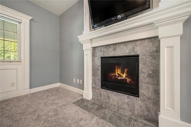 5021 NW Timberline Dr, Riverside, MO 64150 - detailed view of a tiled fireplace and baseboards