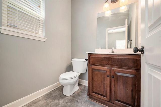 5021 NW Timberline Dr, Riverside, MO 64150 - half bath with toilet, vanity, baseboards, and healthy amount of natural light