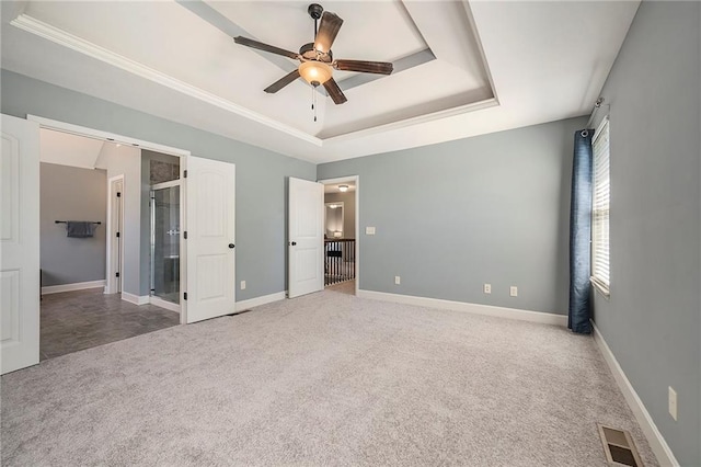 5021 NW Timberline Dr, Riverside, MO 64150 - unfurnished bedroom with a tray ceiling, carpet floors, baseboards, and a ceiling fan