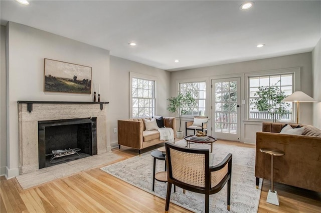 4804 Jarboe St, Kansas City, MO 64112 - living area featuring a fireplace, wood finished floors, recessed lighting, and baseboards