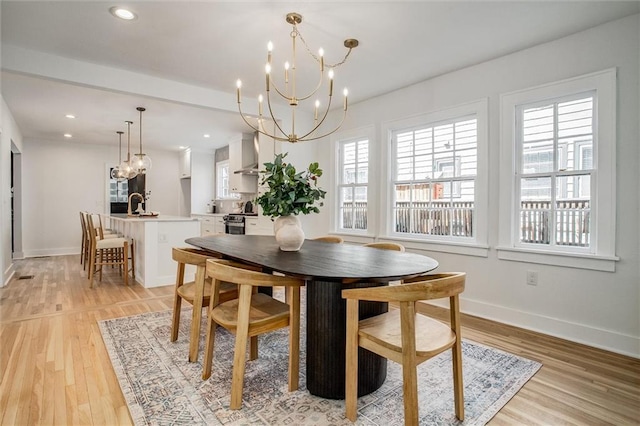 4804 Jarboe St, Kansas City, MO 64112 - dining area featuring a chandelier, healthy amount of natural light, baseboards, and recessed lighting