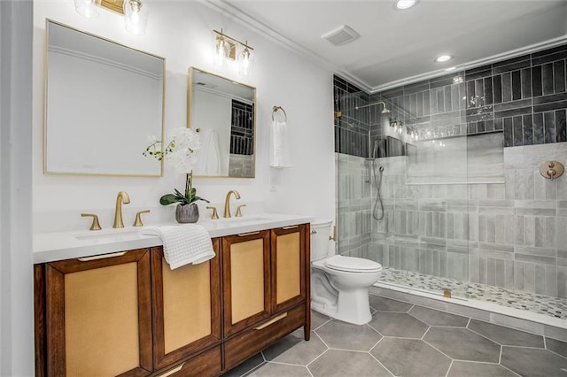 4804 Jarboe St, Kansas City, MO 64112 - full bathroom with double vanity, toilet, crown molding, a tile shower, and tile patterned floors