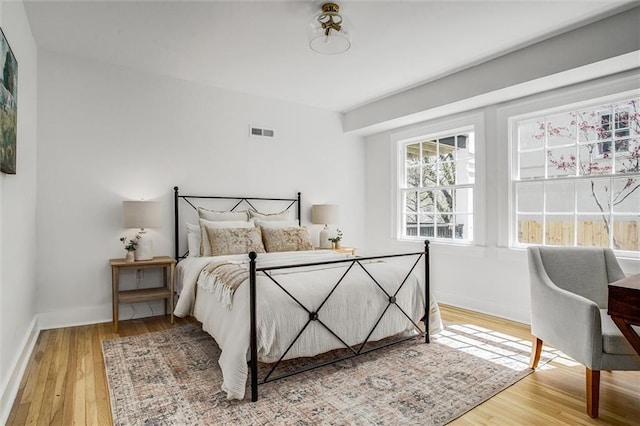 4804 Jarboe St, Kansas City, MO 64112 - bedroom featuring wood finished floors and baseboards
