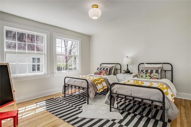 4804 Jarboe St, Kansas City, MO 64112 - bedroom with baseboards and wood finished floors