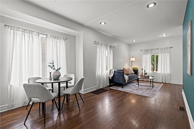 4421 Tracy Ave, Kansas City, MO 64110 - dining room with baseboards, recessed lighting, and hardwood / wood-style flooring