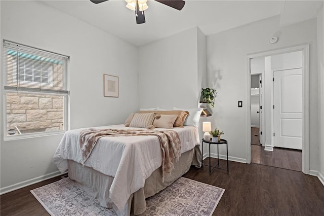 4421 Tracy Ave, Kansas City, MO 64110 - bedroom with wood finished floors, baseboards, and ceiling fan