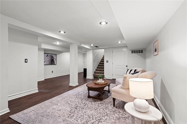 4421 Tracy Ave, Kansas City, MO 64110 - living room featuring wood finished floors, recessed lighting, baseboards, and stairway