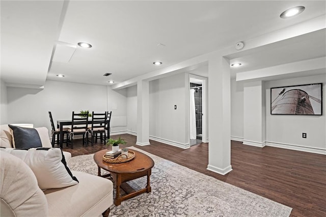 4421 Tracy Ave, Kansas City, MO 64110 - living room featuring wood finished floors, baseboards, and recessed lighting