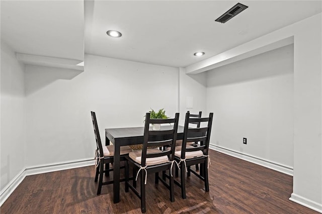 4421 Tracy Ave, Kansas City, MO 64110 - dining area with wood finished floors, baseboards, and recessed lighting