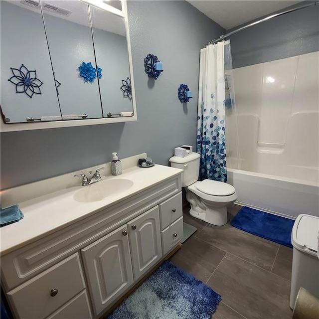1525 Duncan St, Saint Joseph, MO 64503 - full bath featuring toilet, vanity, shower / bath combination with curtain, and tile patterned flooring