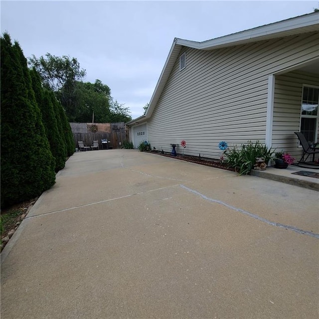 1525 Duncan St, Saint Joseph, MO 64503 - view of property exterior with an attached garage and concrete driveway