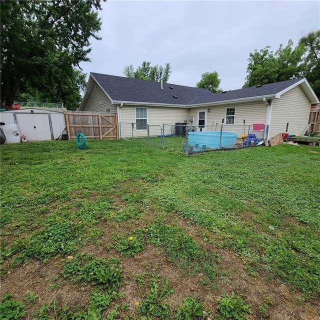 1525 Duncan St, Saint Joseph, MO 64503 - rear view of property featuring a gate